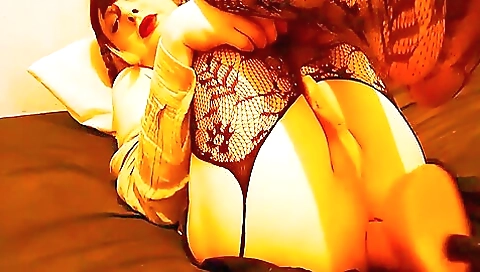 Sexy brunette in lingerie fucking herself on a toy