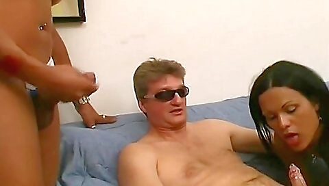 Mature black girl gives a blowjob to two black guys