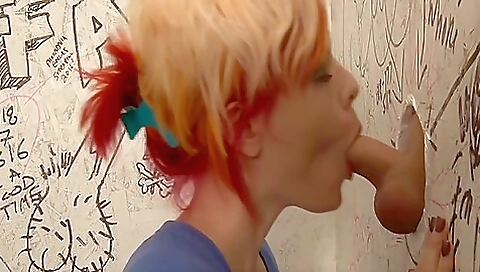 Slutty trans blonde with huge tits and a sexy ass is giving a blowjob