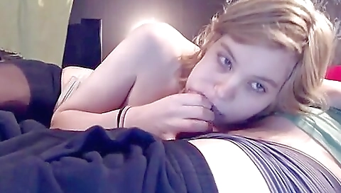 Blonde amateur is sucking cock in front of the camera