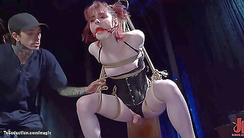 Bondage gagbing with a big red dildo in bondage suit